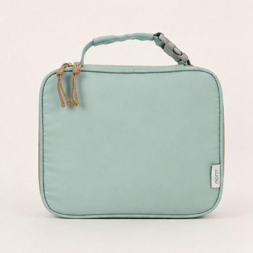 Nom insulated lunch bag in mint green, front view with top handle and dual zipper