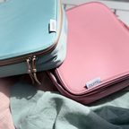 Nom insulated lunch bags in Pink and mint green colors, reusable lunch bags for kids, school, daycare, and family outings.