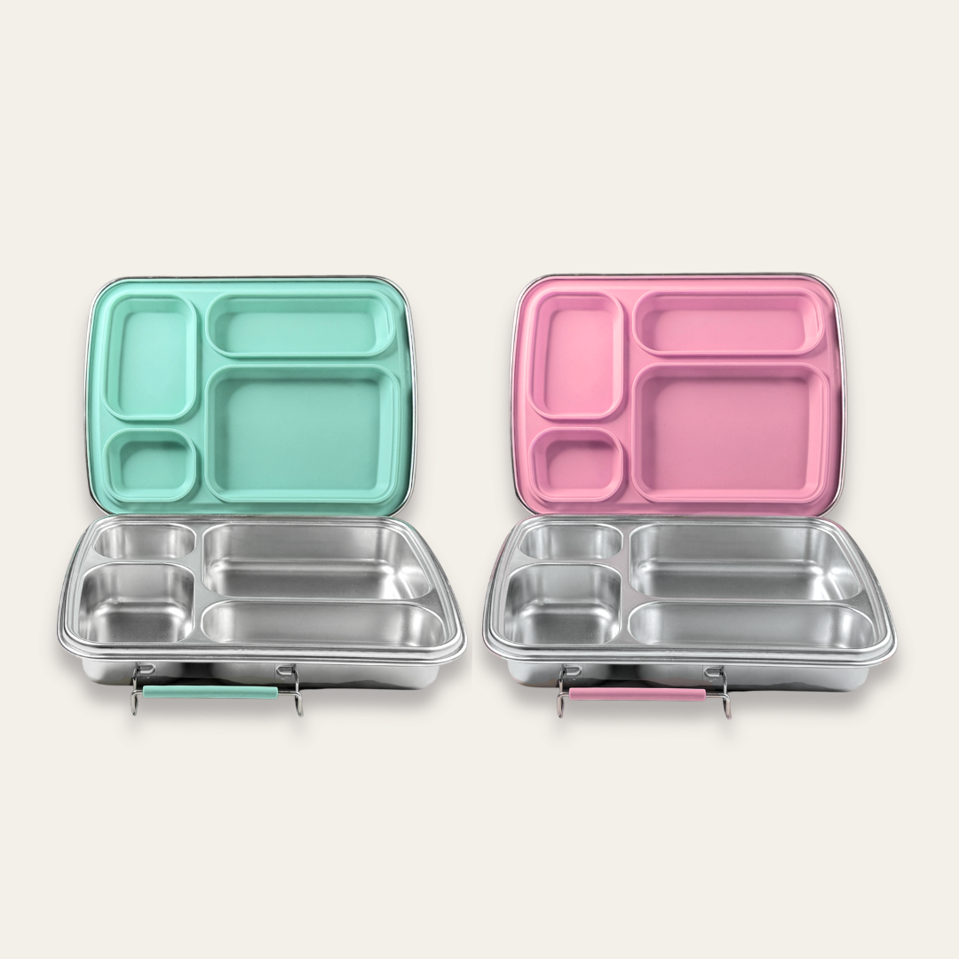 Stainless steel bento lunch box shown in mint green and bubble gum pink color options, 4 compartment design, nom quad by nom
